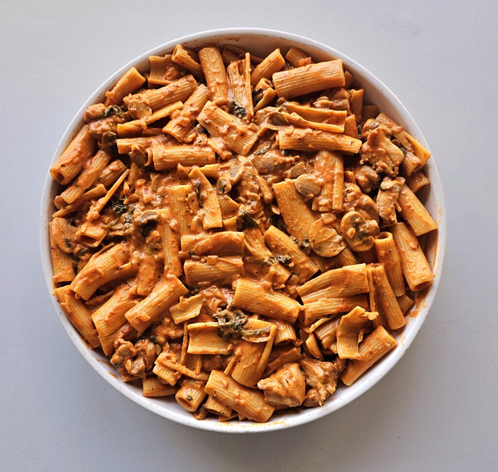 assemble the chicken pasta bake in a casserole dish